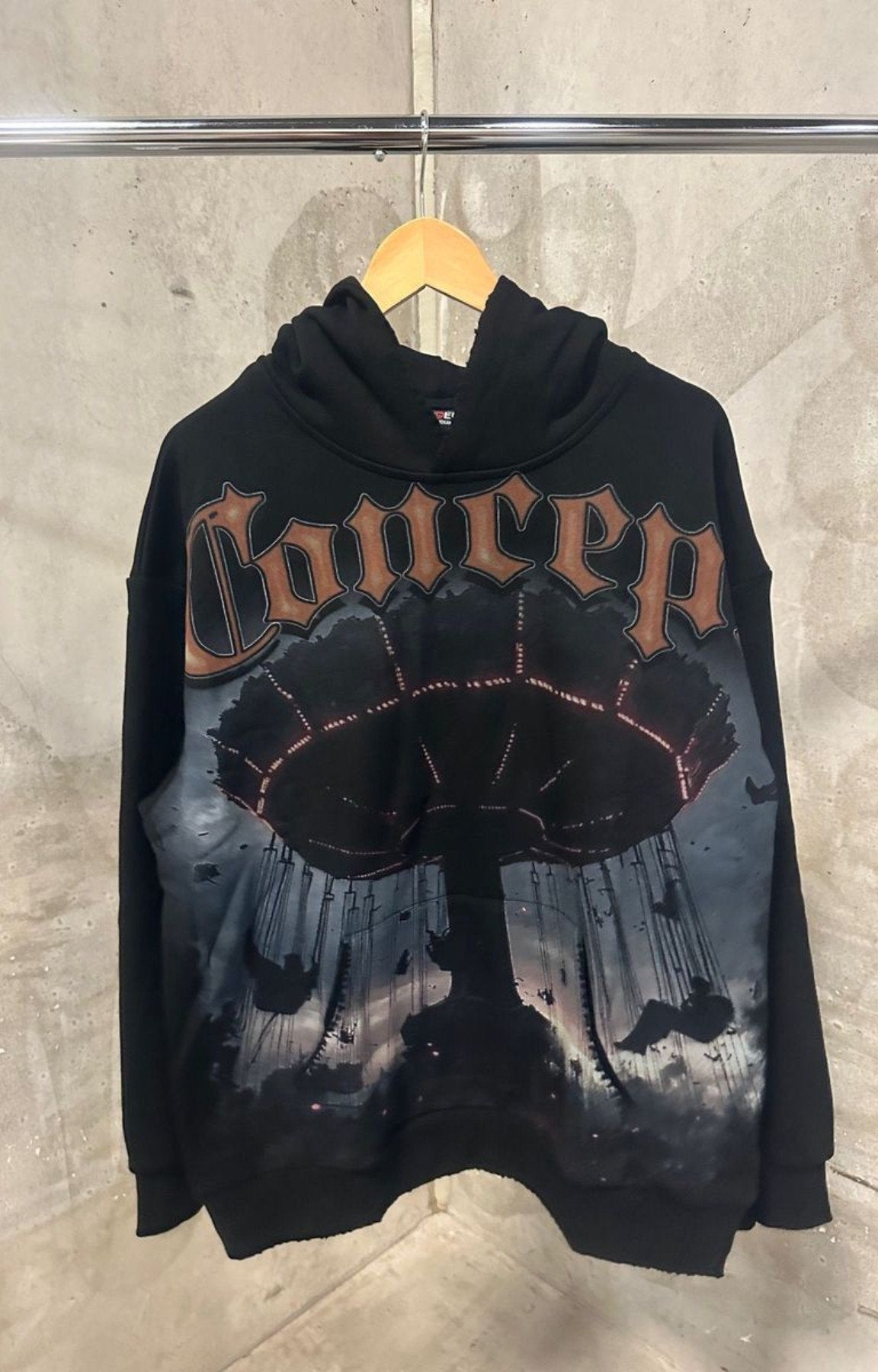 Concept Carousel Hoodie Black – Close-Up of Graphic Design.