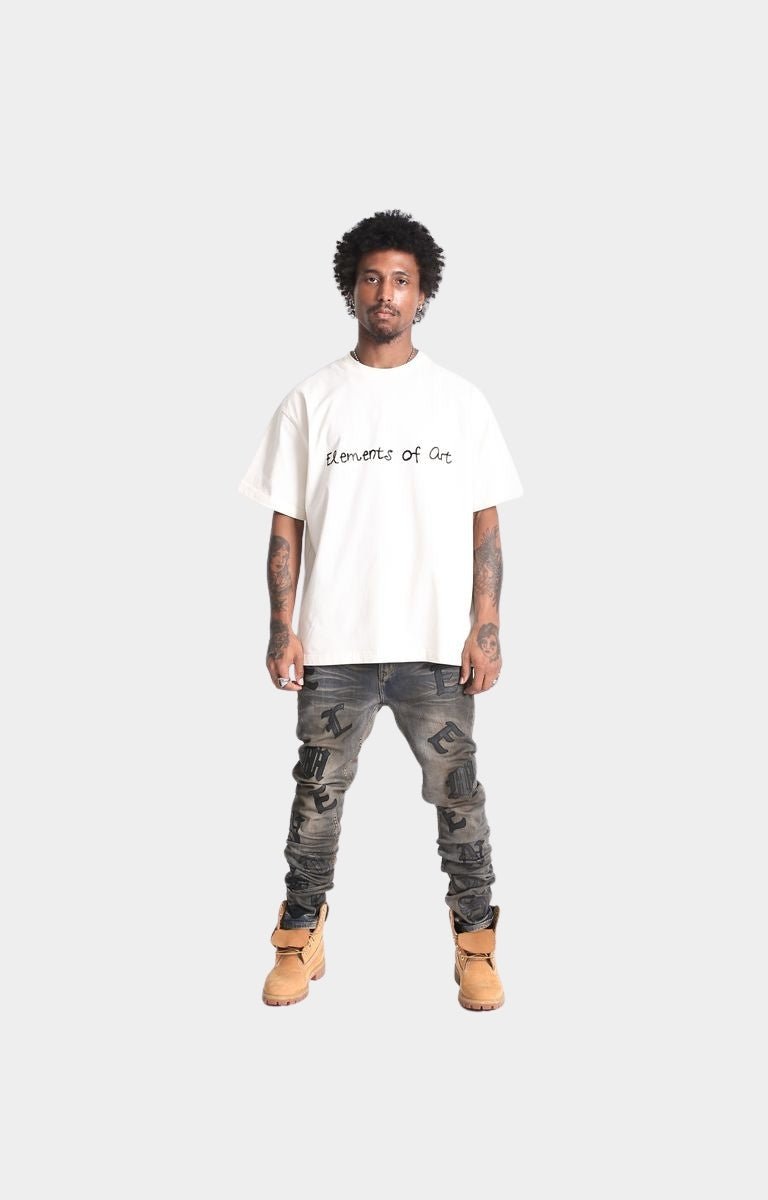 Model wearing Element’s Resort Doodle tee in beige.