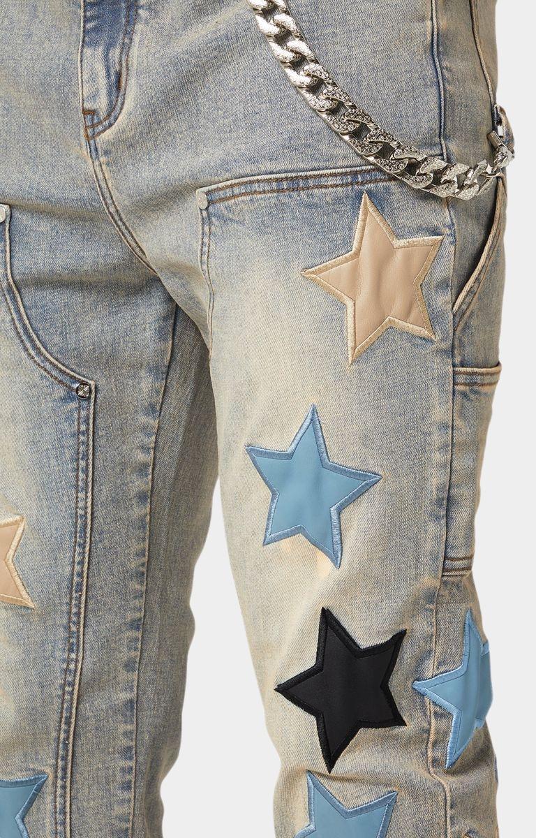 Silver-tone chain accessory on GUAPI Vintage Stars Denim.