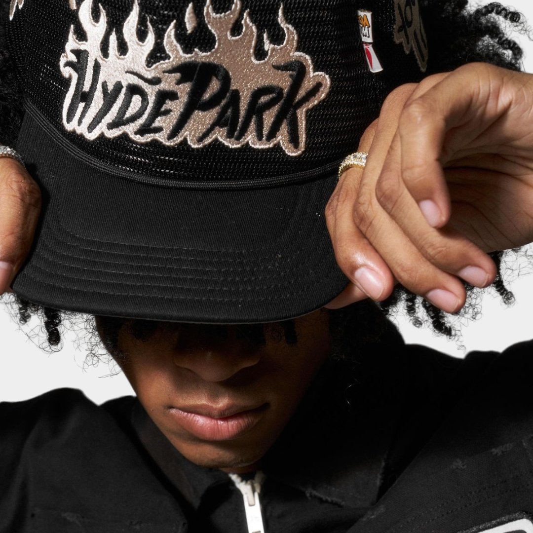 Close-up of Hyde Park Nothing But Net logo detail on trucker hat