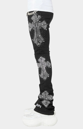 Obsidian Black skinny denim with embroidered GUAPI logo and embellishments.