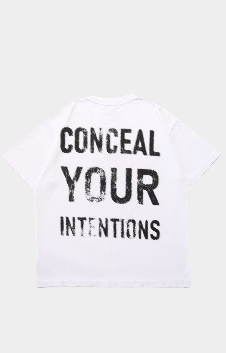 Back view of Conceal Your Intentions tee with blurred text print.