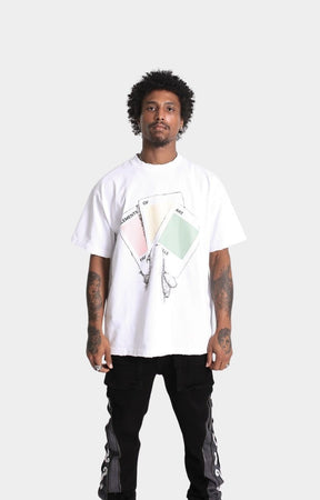 Raw hem detailing on Conceal Your Intentions oversized graphic tee.