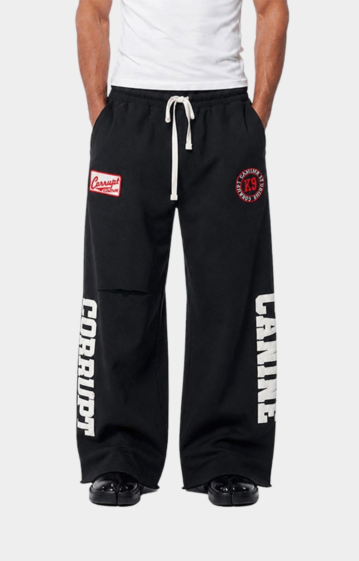 Embroidered Corrupt K9 logo patch detail on heavyweight sweatpants.