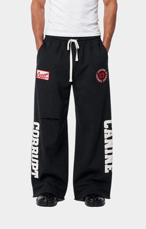 Embroidered Corrupt K9 logo patch detail on heavyweight sweatpants.