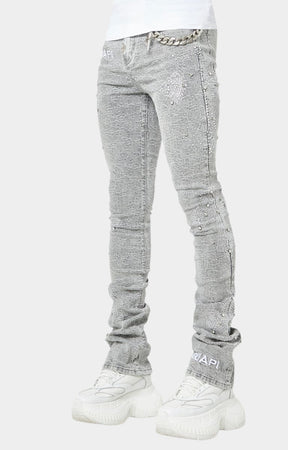Distressed grey skinny jeans with detachable silver chain by GUAPI.