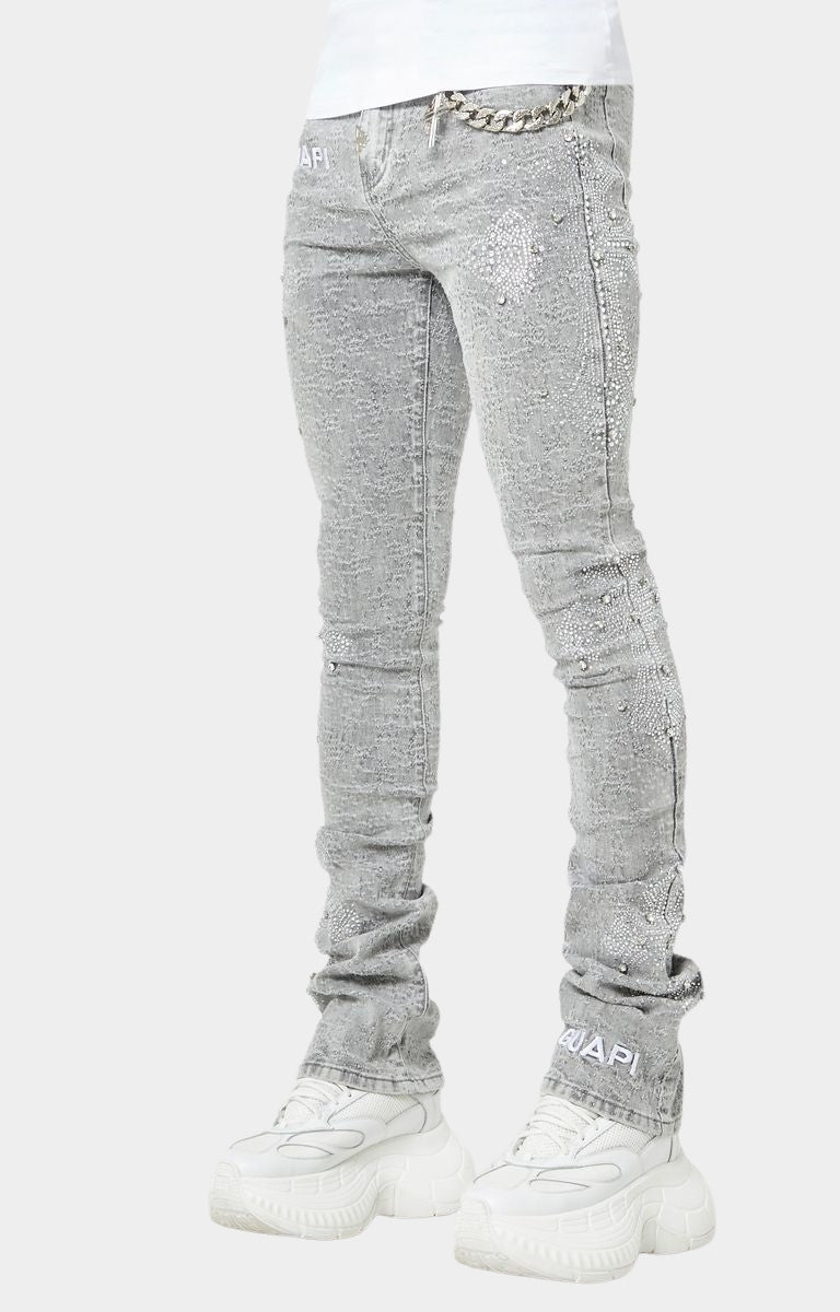 Distressed grey skinny jeans with detachable silver chain by GUAPI.