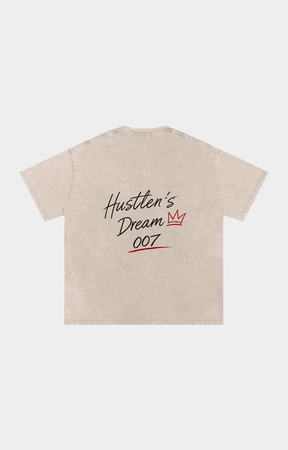 Drip Trap light beige short-sleeve t-shirt with a graphic on the chest reading 'Hustler's Dream 007' in black script and red text.