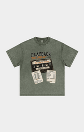 Drip Trap The Come Up washed olive green short-sleeve t-shirt with a vintage cassette tape graphic on the chest. The graphic features the text 'PLAYBACK' and 'JACKIE ANONE OF THE BEST OF 2000' with retro receipts and labels.