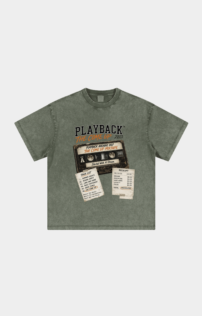 Drip Trap The Come Up washed olive green short-sleeve t-shirt with a vintage cassette tape graphic on the chest. The graphic features the text 'PLAYBACK' and 'JACKIE ANONE OF THE BEST OF 2000' with retro receipts and labels.