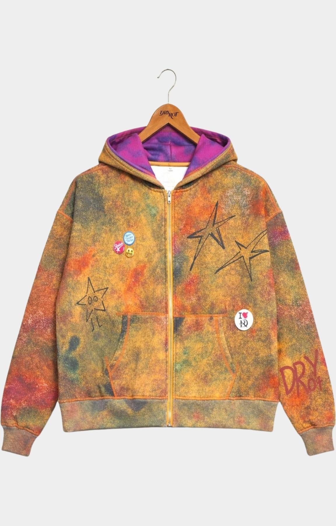 Dry Rot Acid Dust Zip Up Hoodie front view with a vibrant orange, yellow, and green tie-dye pattern, featuring a purple-lined hood, black star graphics, and small colorful patches.