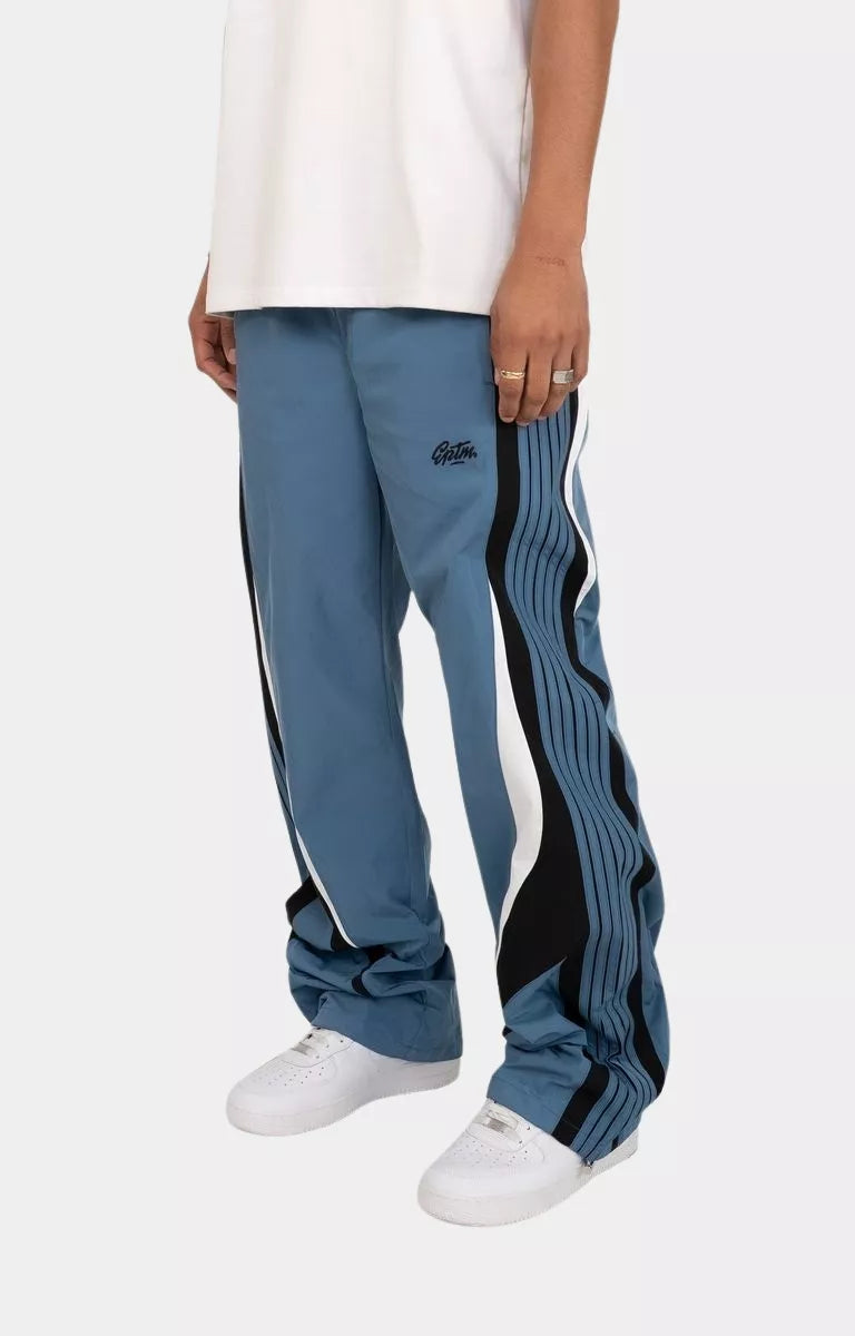 Side view of model wearing EPTM Baladin relaxed fit pants.