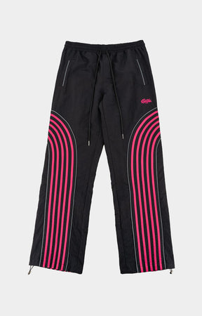 Shop EPTM Flasher Pants in Black, featuring bold pink pop-color tape, signature 3M reflective accents and a 100% polyester construction. Designed with an elastic drawstring waistband, front welt pockets, a back pocket and adjustable bottom toggles for versatile streetwear styling.