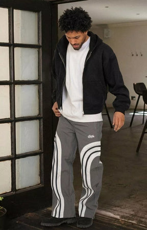 Model wearing EPTM Lukens Pants Grey streetwear outfit front pose.