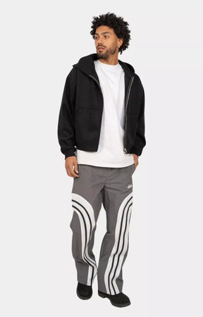 Streetwear styling with EPTM Lukens reflective pants and hoodie.