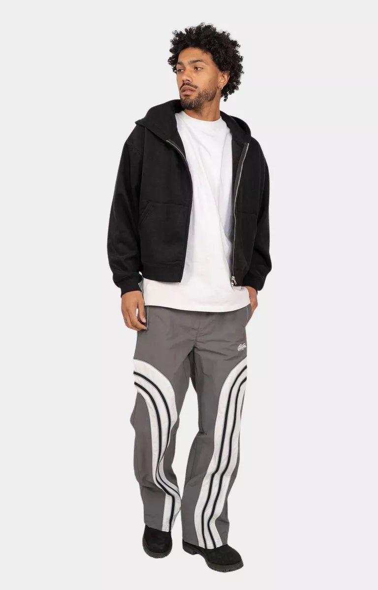 Streetwear styling with EPTM Lukens reflective pants and hoodie.