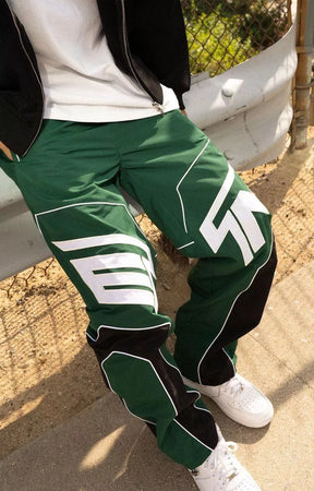 Premium hunter green streetwear joggers with oversized EPTM branding