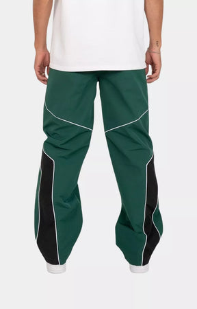 Back view of EPTM Rogue Pants in Hunter Green with oversized logo applique