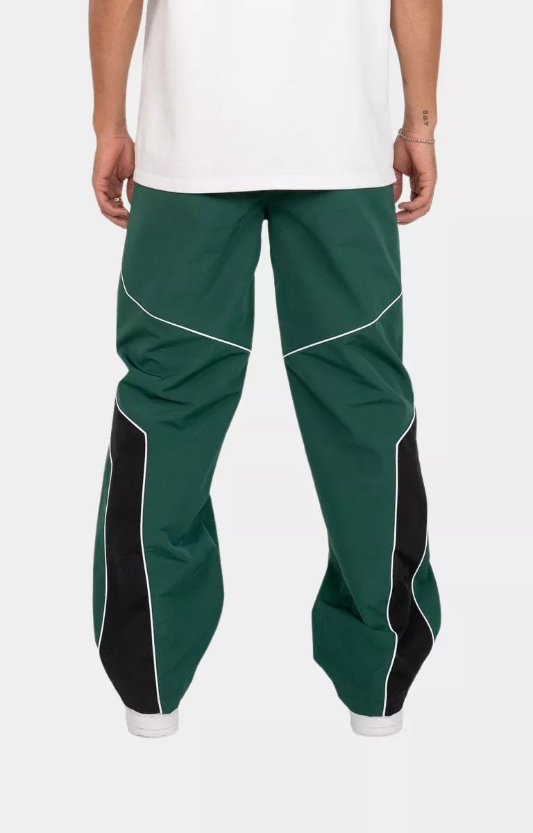 Back view of EPTM Rogue Pants in Hunter Green with oversized logo applique