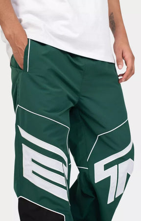 Close up oversized EPTM logo applique on Rogue Pants Hunter Green