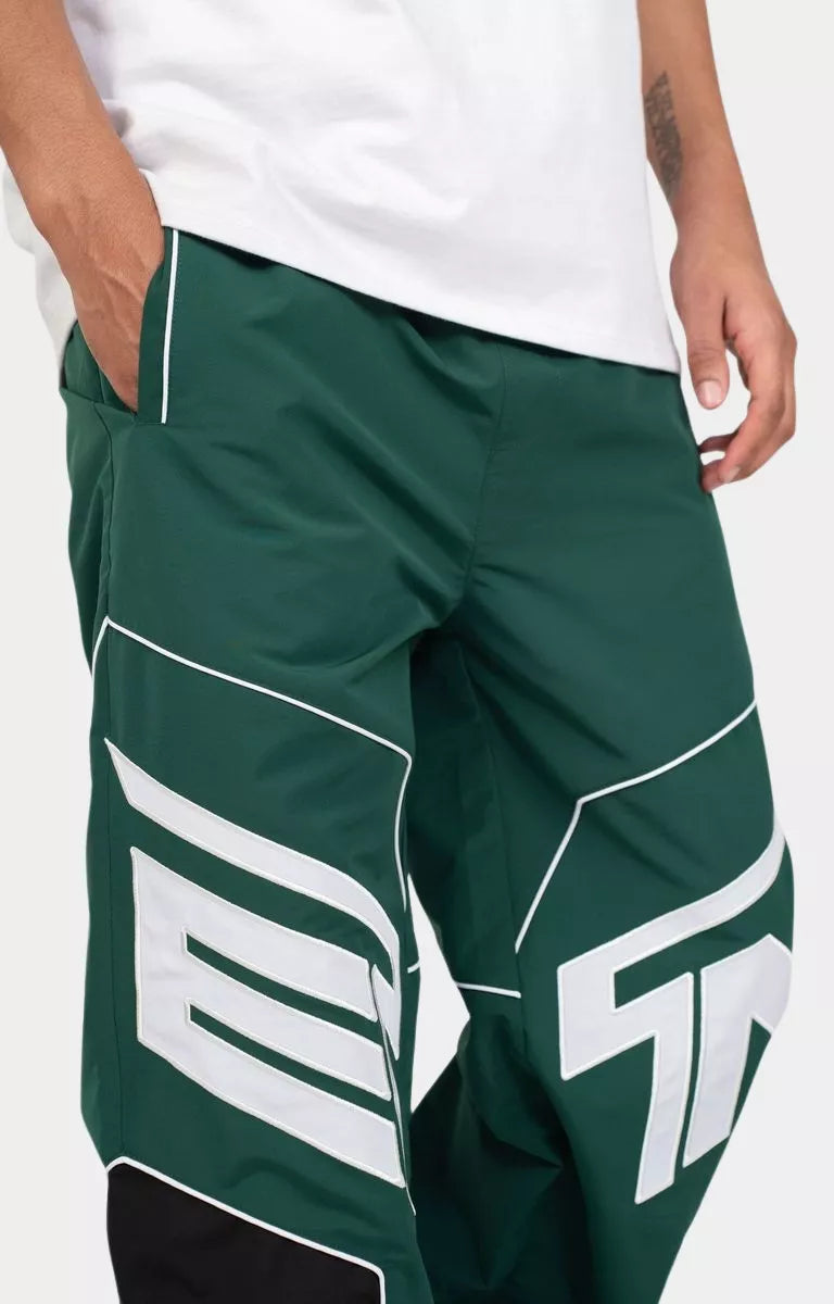 Close up oversized EPTM logo applique on Rogue Pants Hunter Green