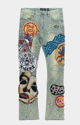 Front view of Frost BRAVE HEART stacked denim jeans with tapestry patches.
