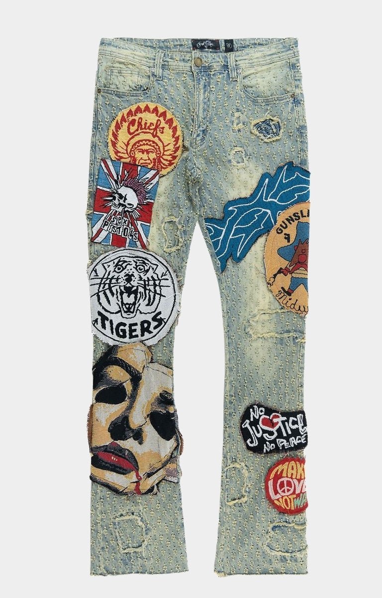 Front view of Frost BRAVE HEART stacked denim jeans with tapestry patches.
