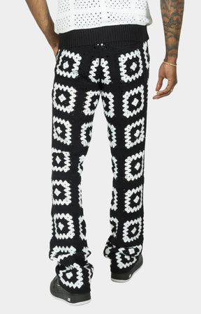 Back view of Frost Nuevo Riche Black White stacked sweatpants.