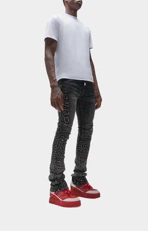 Lifestyle shot of Blood Red Reign sneakers styled with streetwear.