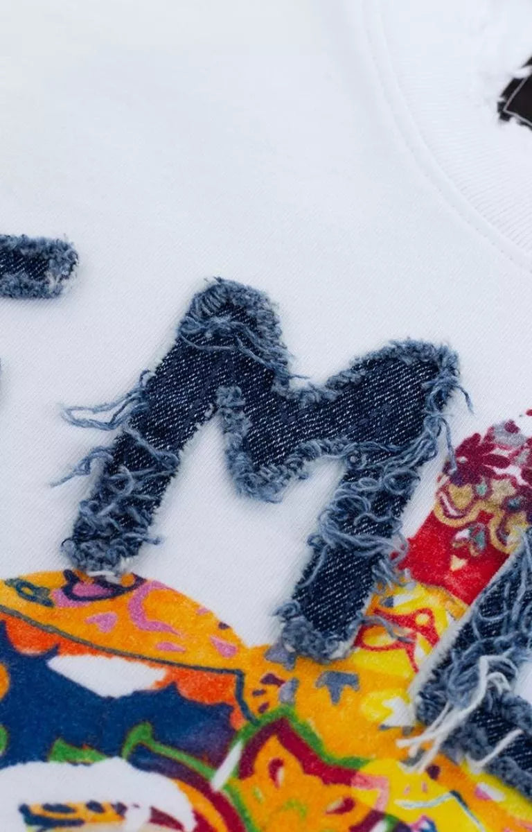 Front graphic detail on GFA Manasseh Midlo Short Sleeve Knit. 