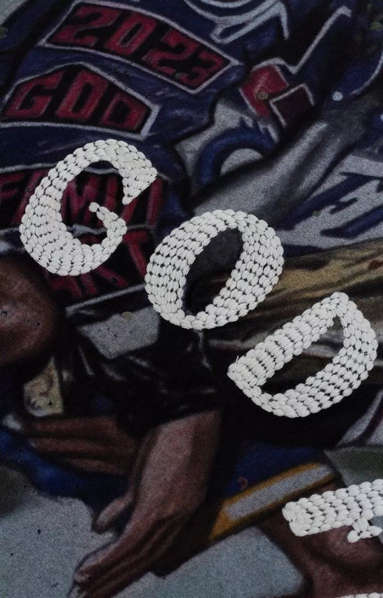 Heavy yarn embroidery detail on GFA Manasseh Victor Knit.