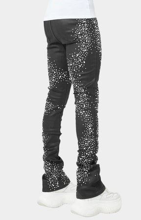 Back view of black skinny jeans with gradient pearl details.