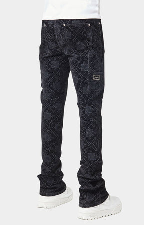 Stacked hem closeup of luxury guapi black velour denim pants