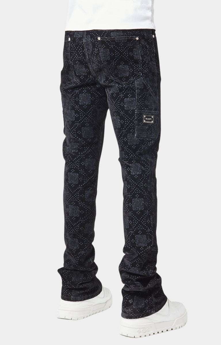 Stacked hem closeup of luxury guapi black velour denim pants