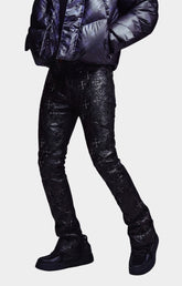 Slim stacked fit of Guapi All Black Relic Waxed Denim.