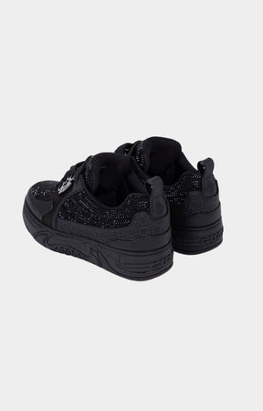 Angled view of black rhinestone designer sneaker.