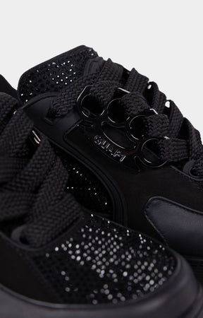 Brass knuckle lace holder detail on Guapi sneaker.