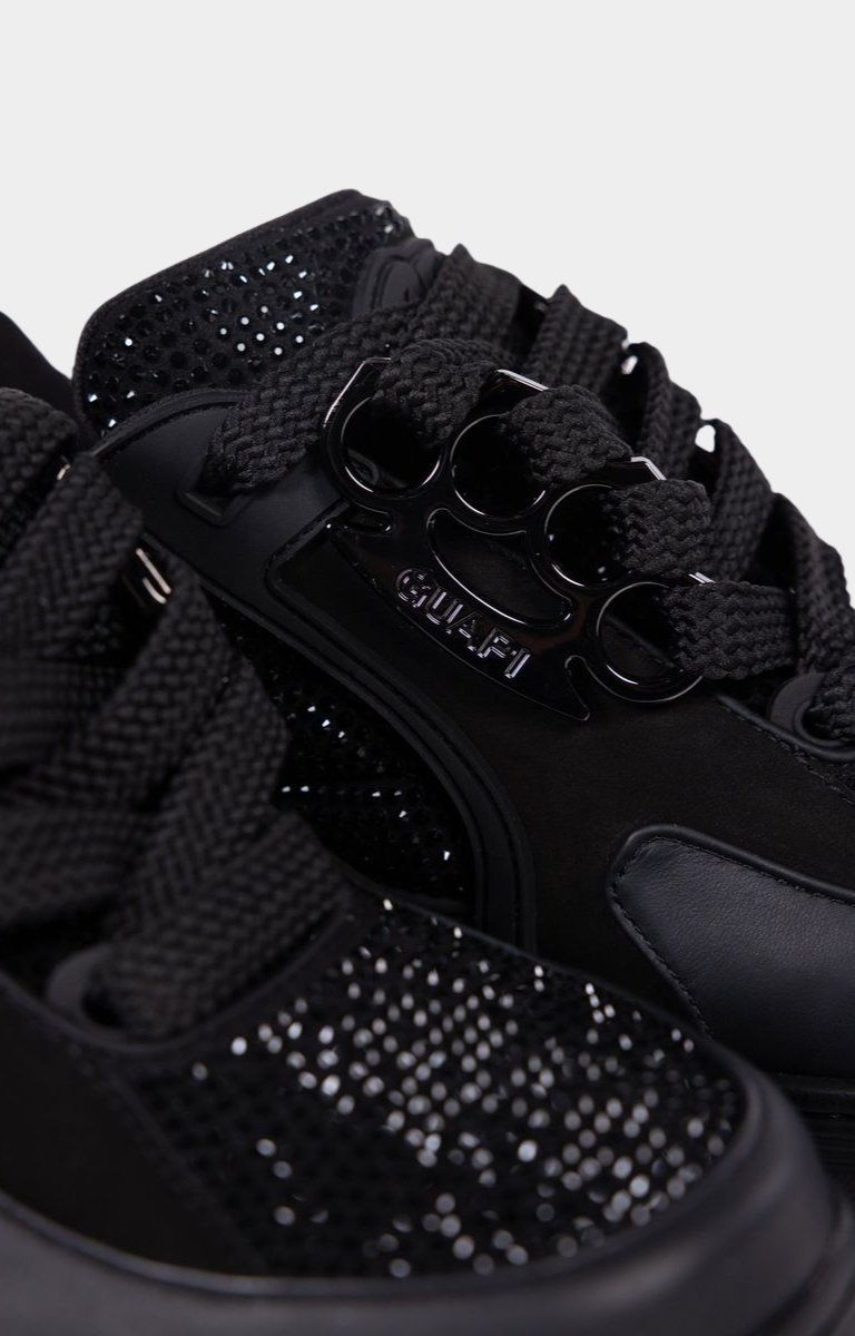 Brass knuckle lace holder detail on Guapi sneaker.