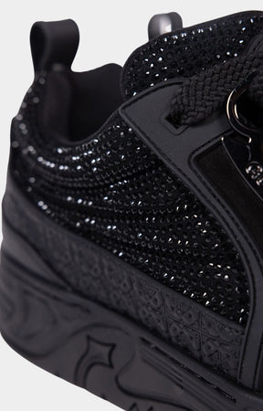 Close-up of rhinestone embellishments on leather upper.