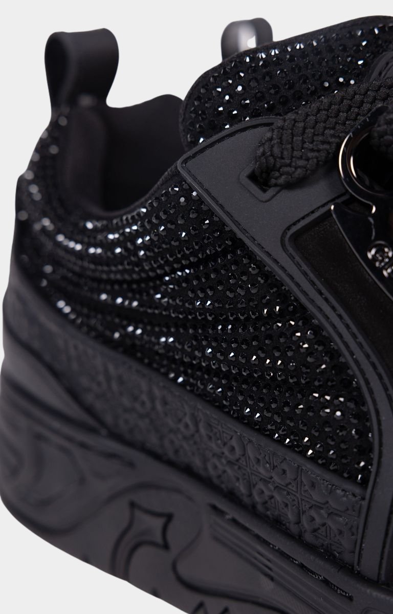 Close-up of rhinestone embellishments on leather upper.