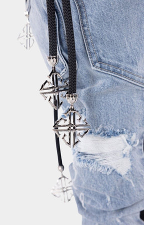 Distressed hybrid cargo pants featuring denim and PU leather materials.
