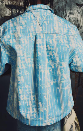 Aqua blue and white abstract graphic pattern on the Guapi Glock 17 Shirt.