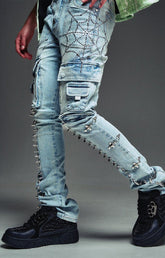 Guapi cargo jeans with rhinestone web embellishment and spikes.