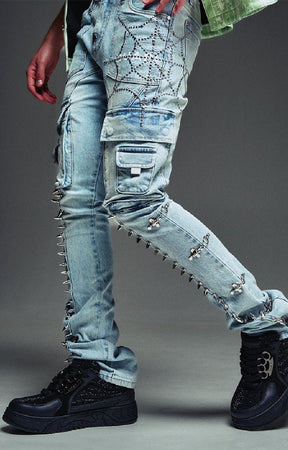 Guapi cargo jeans with rhinestone web embellishment and spikes.