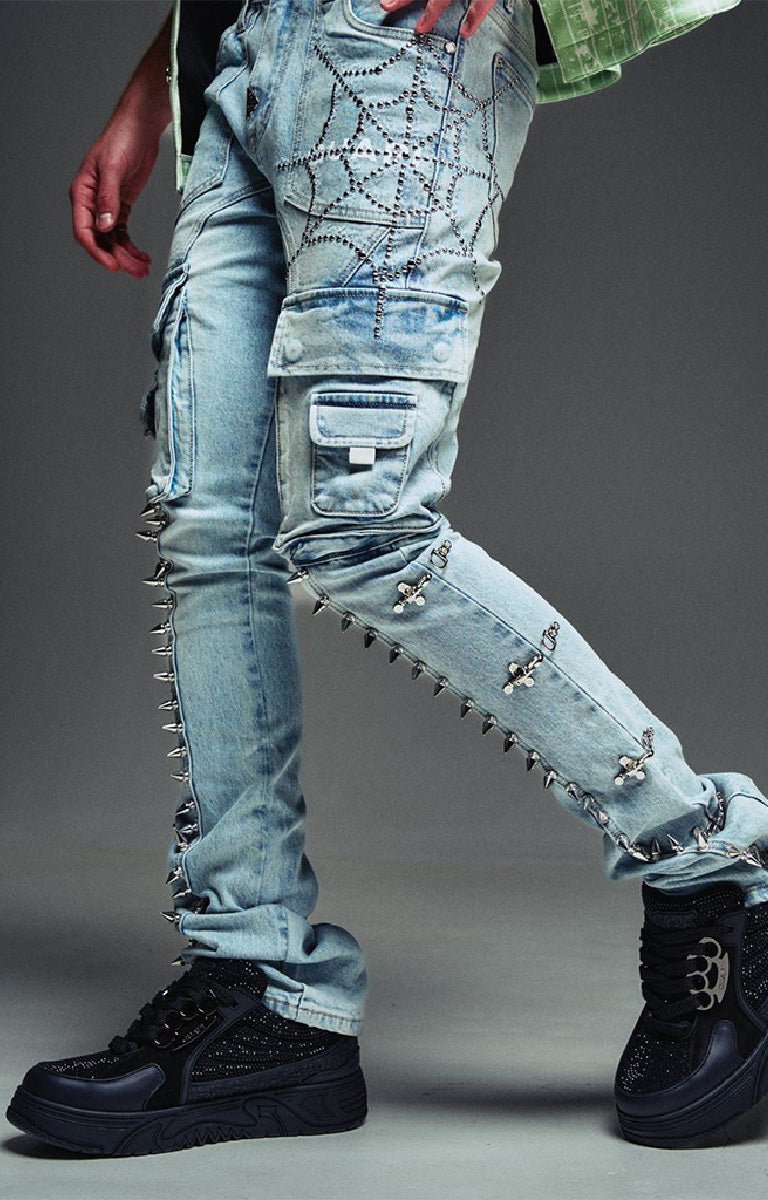 Guapi cargo jeans with rhinestone web embellishment and spikes.