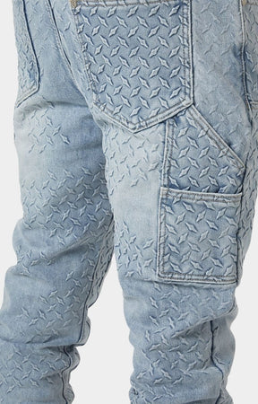 Raised steel plate embossed texture on Guapi denim.