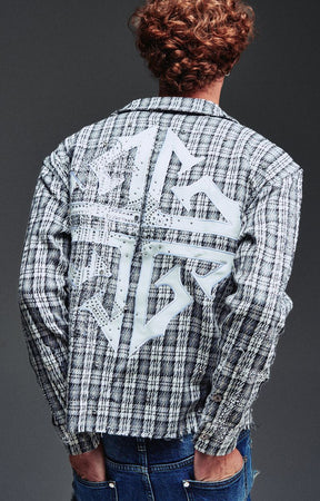 Guapi Ash Plaid Shirt featuring a grey and black plaid pattern, loop-and-toggle closures, open collar, graphic detailing, long sleeves, and relaxed fit.