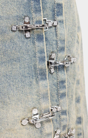 Side profile showing industrial clasp system on GUAPI denim shorts.