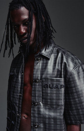 Guapi All Black Grenade Leather Shirt featuring a textured leather-look finish, tonal plaid detailing, toggle closures, embroidered branding and relaxed fit.