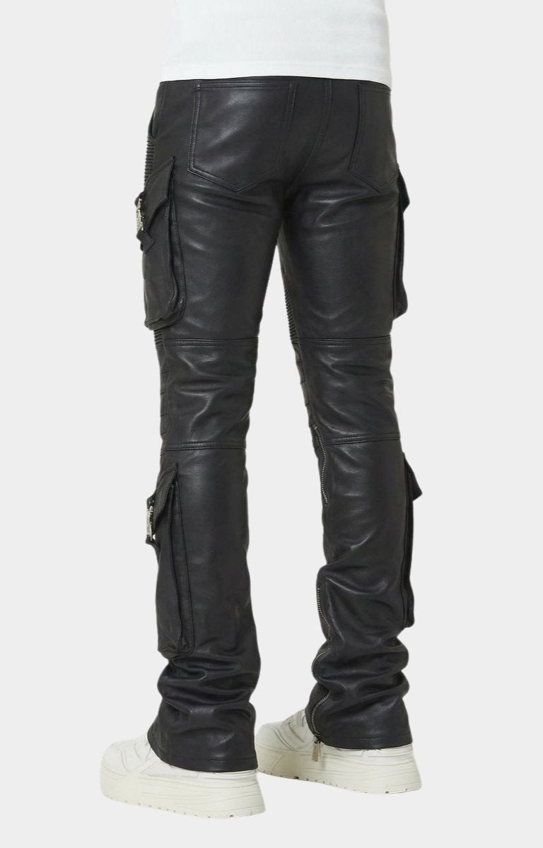 Tonal distressed detailing on black leather pants.
